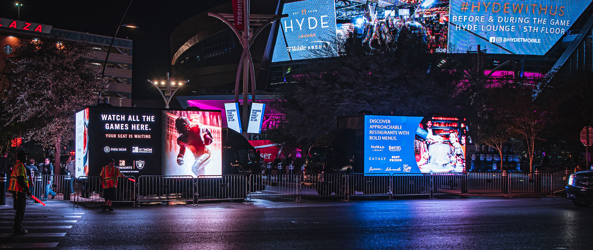 Image of two Digital Billboard Trucks sitting In front of Tmobile Stadium